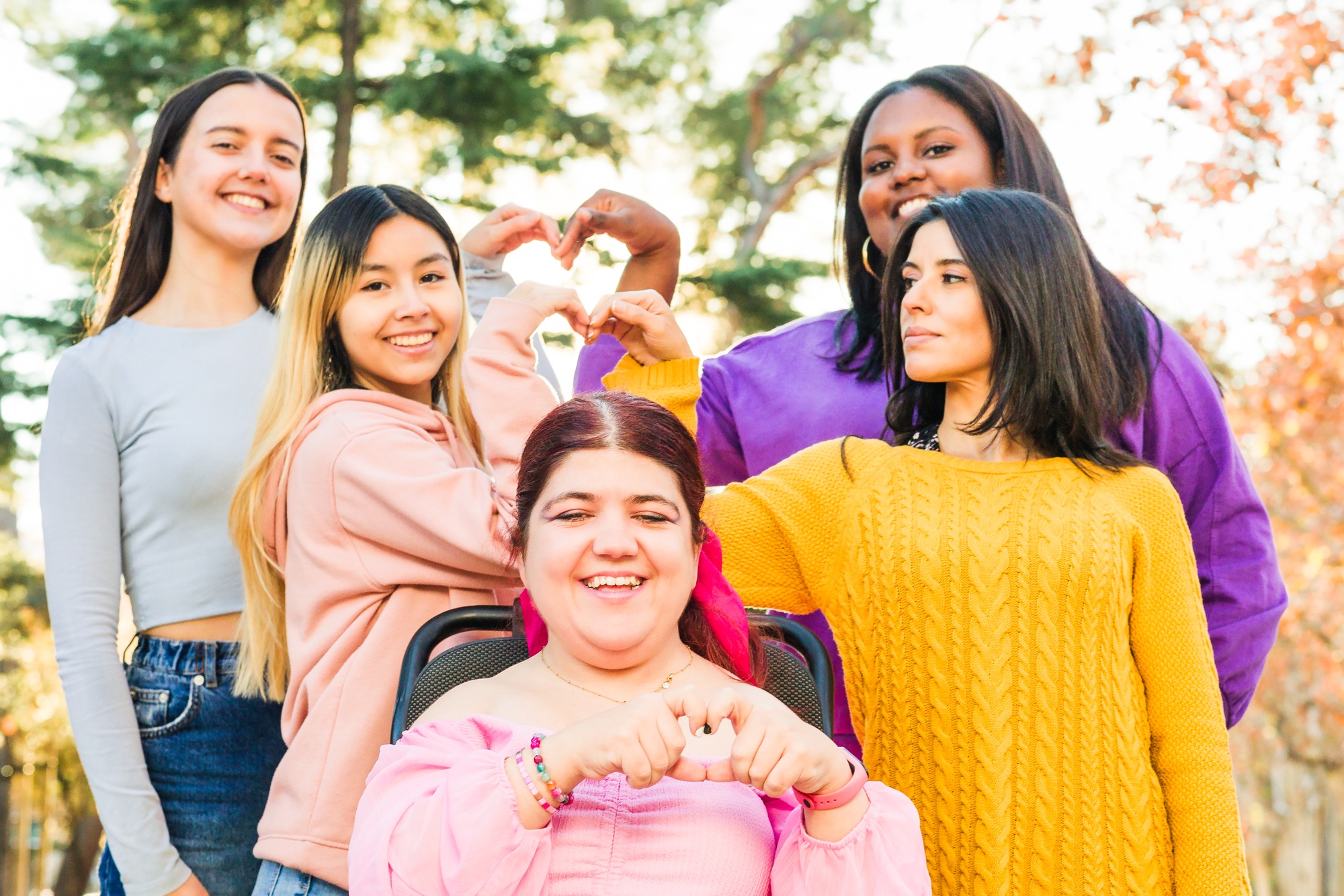 Inspire Inclusion international womens day. Diverse group do heart love with hands. Disability